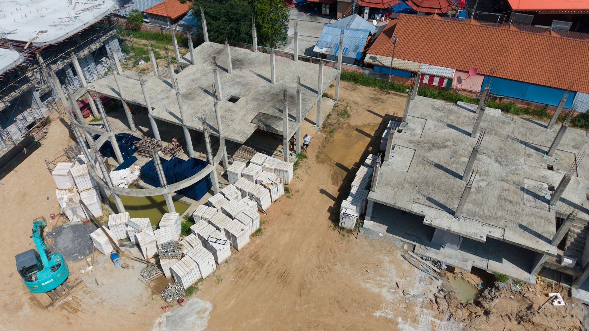 Concrete frames rising and the lagoon pool area taking shape at Coral Condo Samui