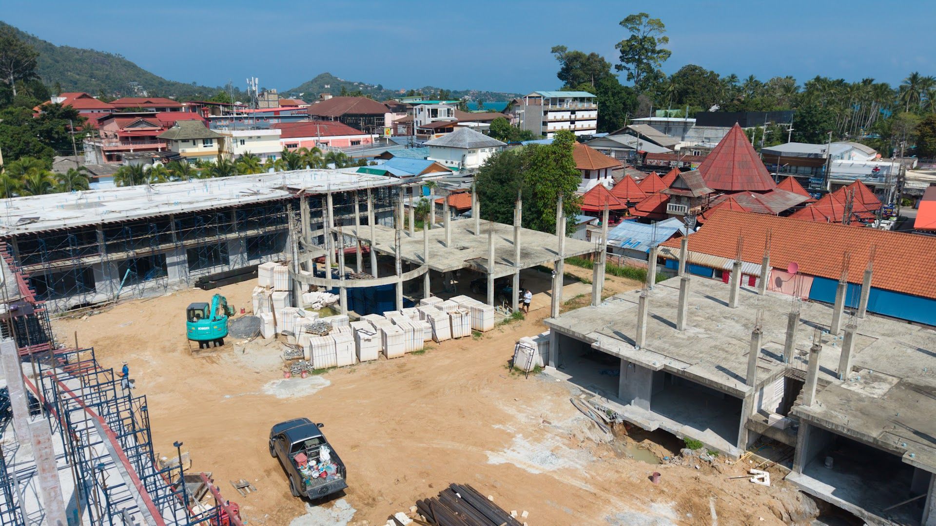 Construction progress at Coral Condo Samui with Lamai temple roofs behind