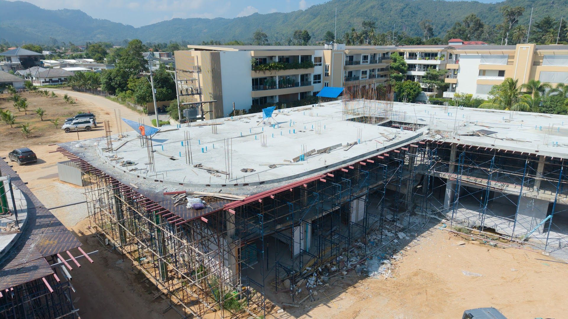 First-floor slab of a Coral Condo Samui building with the hills of Lamai behind