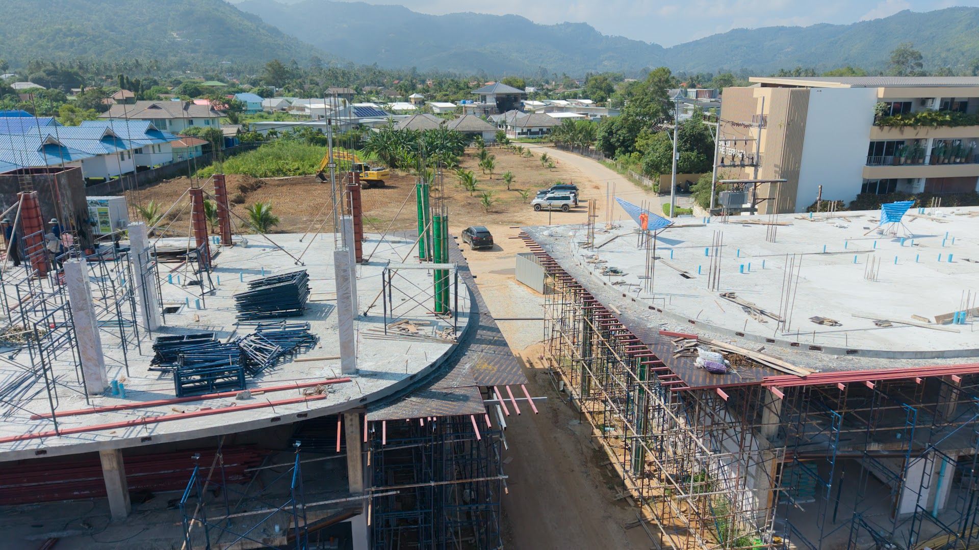 Upper-floor columns and scaffolding at Coral Condo Samui, October 2026