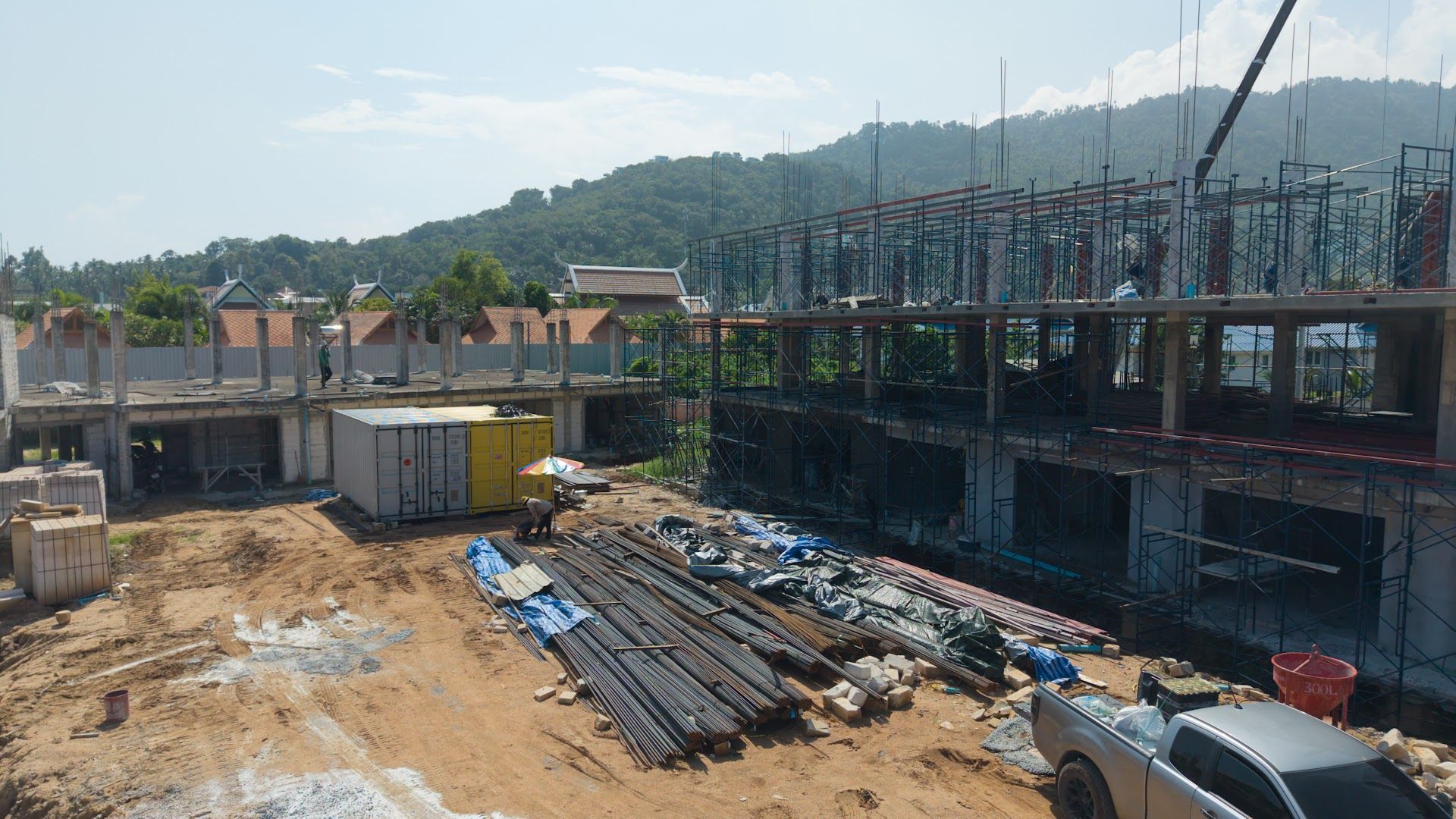 Ground-level view of Coral Condo Samui buildings and site works